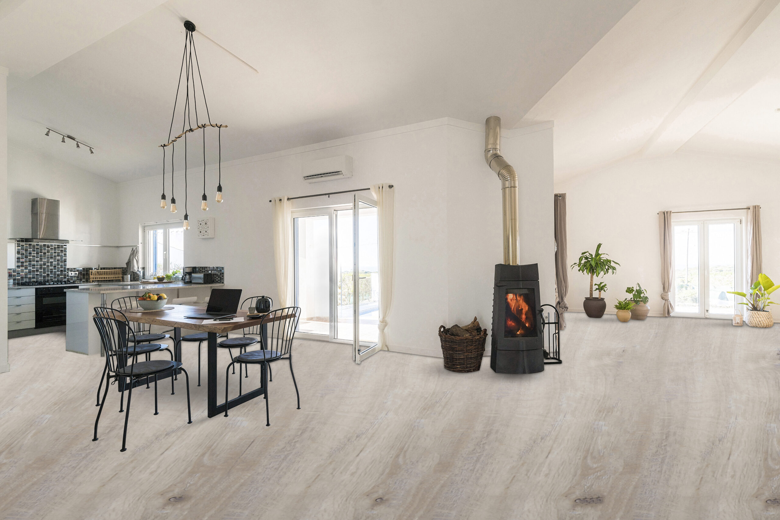 Woman standing in door frame of modern living room with fireplace
