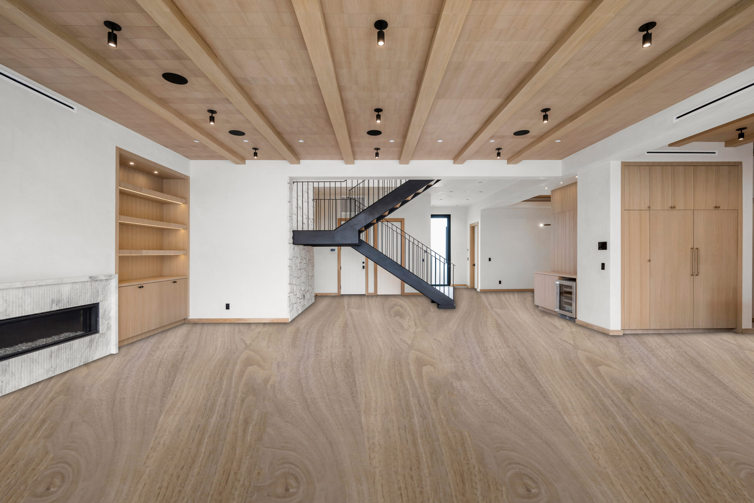 Empty living room with fireplace and wooden ceiling