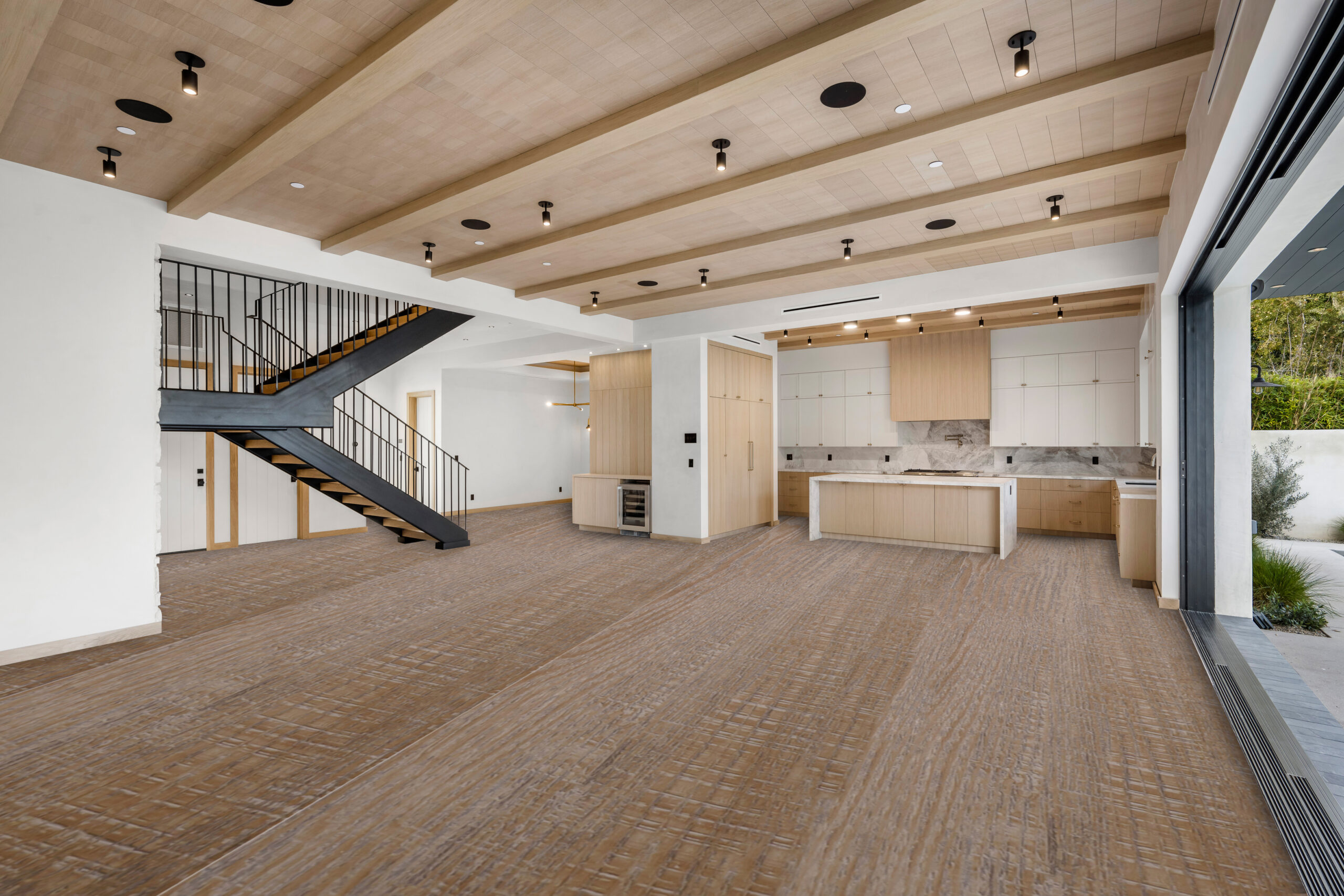 Empty interior of a house with staircase leading to the kitchen